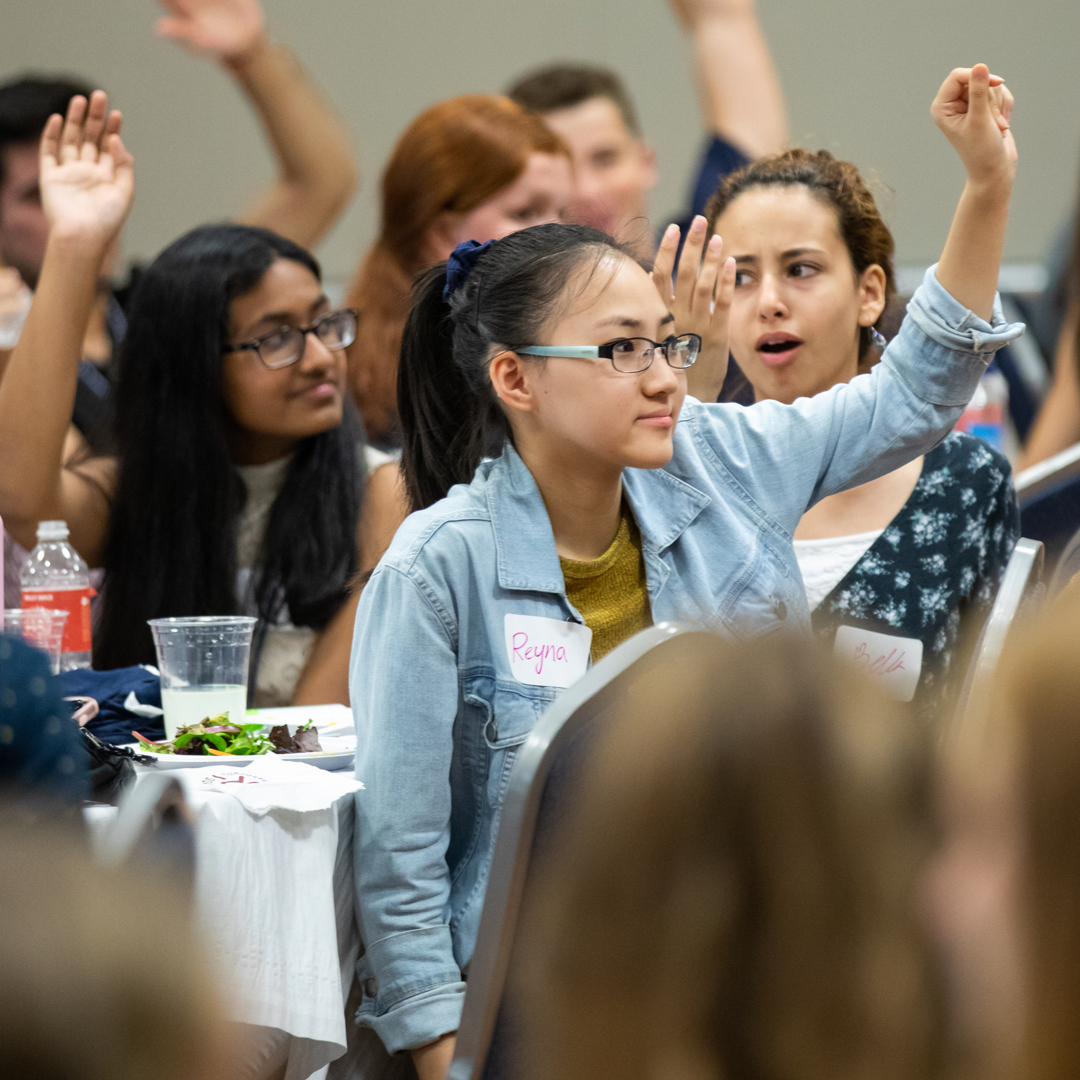 Students raising hands